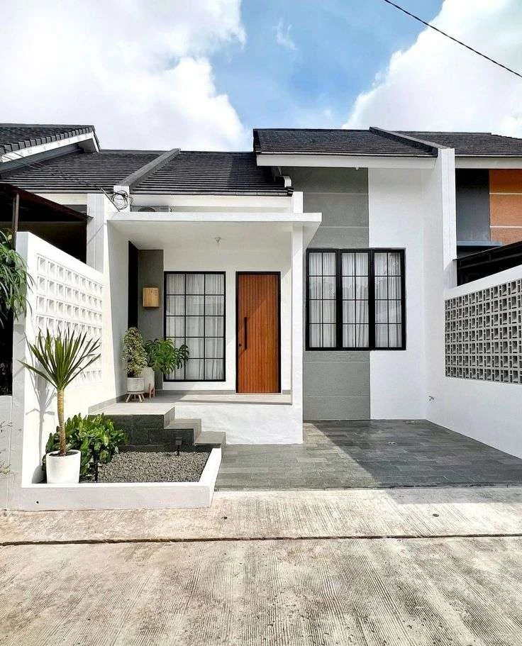 Mặt tiền ngôi nhà hiện đại màu trắng với sân trước nhỏ